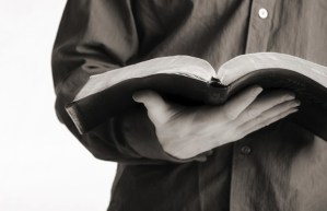 man holding bible